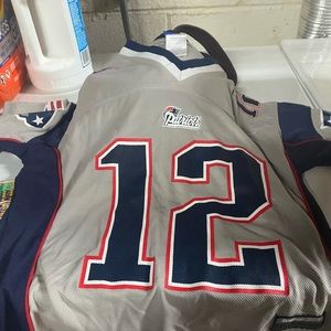Three New England Patriots vintage shirts for kids including jersey shirt